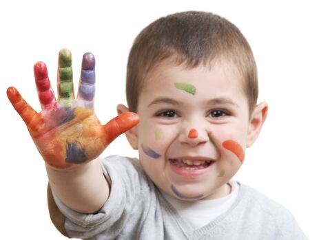 happy little boy with paints on hands isolated on white backgroundの写真素材