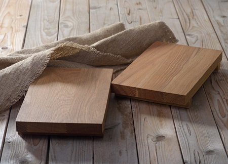 Two empty  chopping boards for dishes on wooden backgroundの写真素材