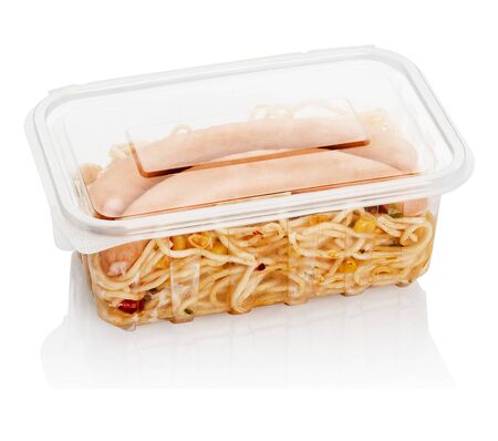 boiled sausages with macaroni in a transparent plastic container for foodの写真素材