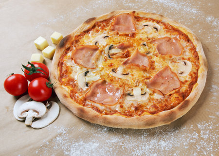 pizza caprichosa with champignons and tomatoesの写真素材