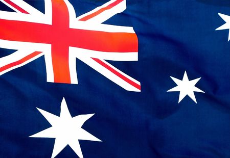 An Australian flag flying in a light breeze.の写真素材