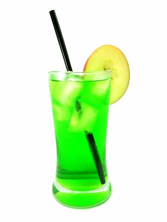A cool green drink with a straw and a slice of apple over white backgroundの写真素材