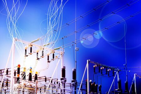 Lightning and electricity streaks from live power lines and wires at an electrical substation