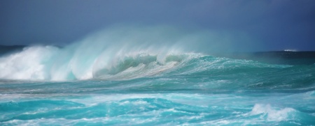 Wild surfing scene with wind-driven sea sprayの写真素材