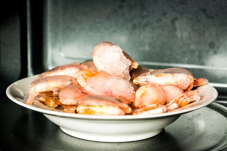 Frozen shrimp covered with a thick layer of ice  In the microwave の写真素材