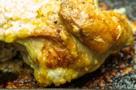 Fried chicken close-up on a bakingの写真素材