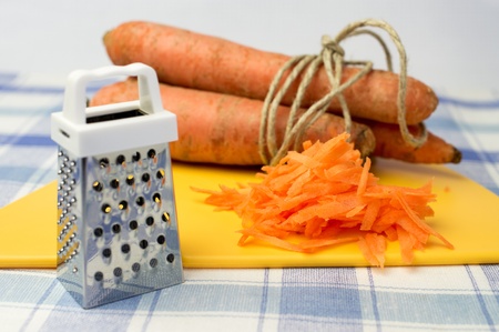Grated carrot, grater for vegetables, carrot farm in conjunctionの写真素材