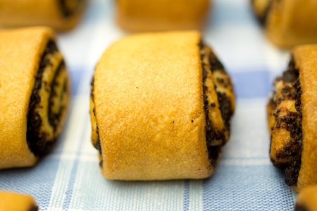Several rolls with poppy seeds on a napkin