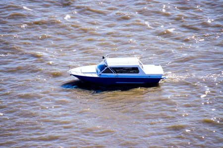 Motor boat floats on the river