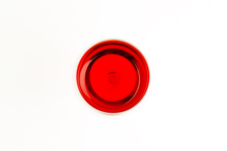Glass of red wine view from above. The red circle on a white backgroundの写真素材