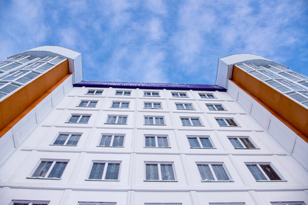 New building with a facade PVC windows and blue sky with cloudsのeditorial素材