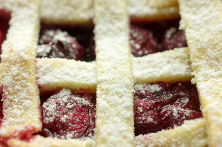 Cherry pie with lattice top close-up.