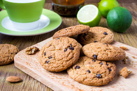 Oatmeal cookies with tea, lime and nutsの写真素材