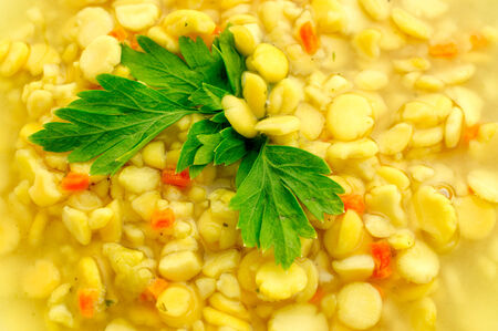 Pea soup in a bowl with parsley  closeupの写真素材