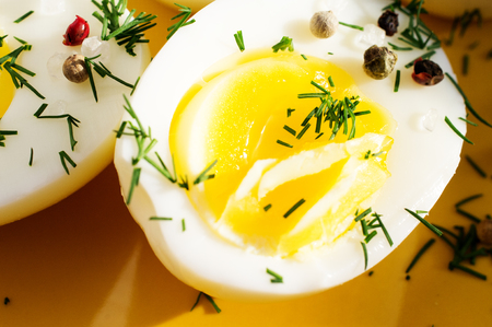 Boiled eggs with salt, pepper and dill