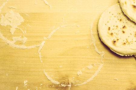 Cutting board with flour and ready matzah, pita bread, biscuitsの写真素材
