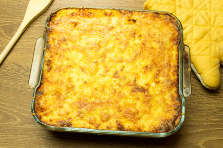Lasagna with crispy cheese crust in the form of a glass baking