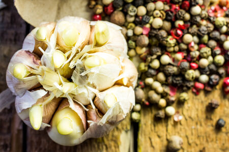 Garlic and pepper on a wooden backgroundの写真素材