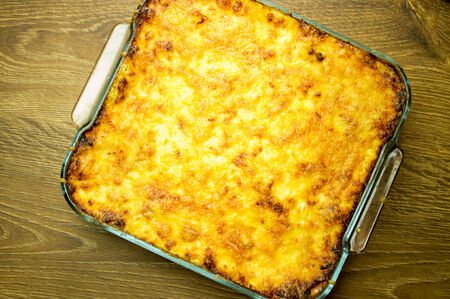Lasagna with crispy cheese crust in the form of a glass bakingの写真素材
