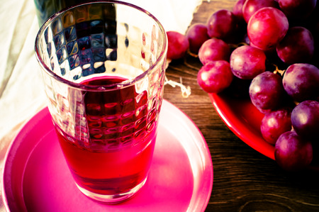 Glass of red wine on the table top viewの写真素材