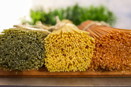 Spaghetti pasta in the colors of the Italian flagの写真素材