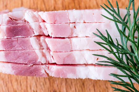Cut into thick strips of bacon pieceの写真素材