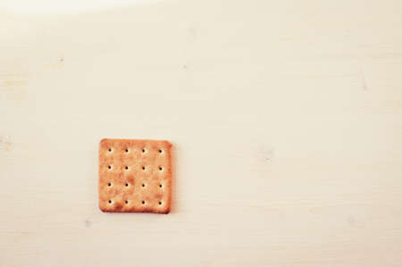 Cracker one on a white table top viewの写真素材