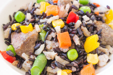 Risotto with wild black rice and vegetables close upの写真素材