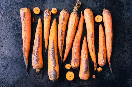 Baked in the oven on a baking carrotの写真素材