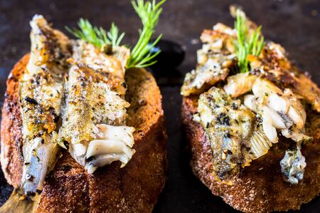 Sandwiches, tapas with grilled fish, capelin, sprats, sardinesの写真素材