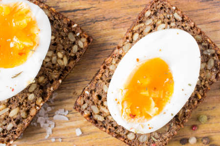 Hard boiled egg sandwich on a tableの写真素材