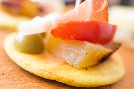 Tapas with bacon and potatoes, olives and tomatoesの写真素材