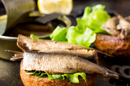 Tapas bun burger with smoked sardines or spratsの写真素材