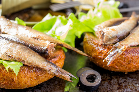 Tapas bun burger with smoked sardines or spratsの写真素材