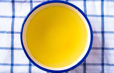 chicken stock in a bowlの写真素材