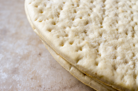 Frozen ready-made pizza dough for background
