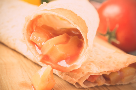 Vegetable stuffing in tortilla thin flatbread. Pastel filterの写真素材