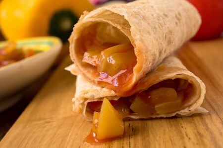 Burrito with vegetables paprika peppers and tomatoesの写真素材