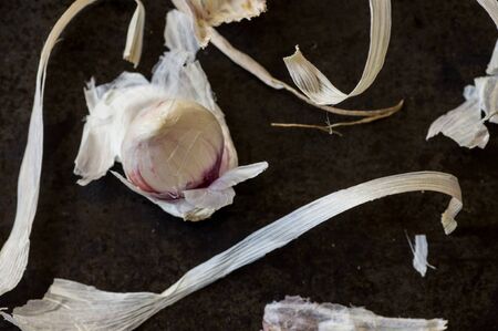 Clove of fresh garlic in the peel view from aboveの写真素材
