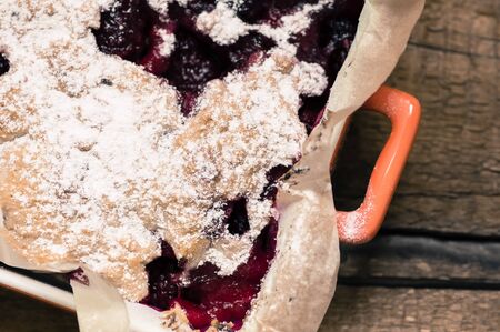 Berry cake sprinkled with powdered sugar top viewの写真素材