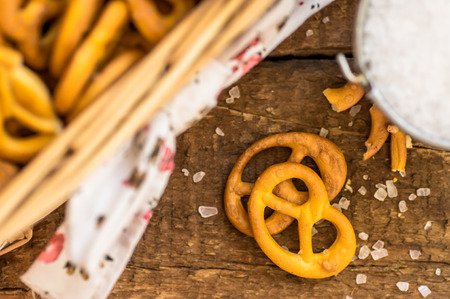 Salty pretzels and salt closeup top viewの写真素材