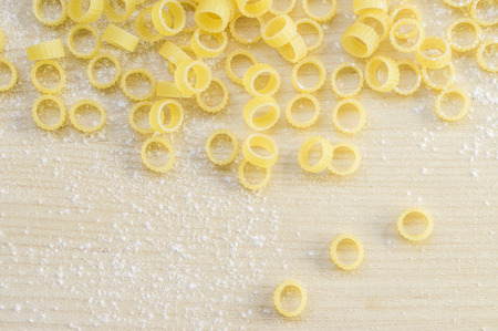 Anellini pasta rings on the table top viewの写真素材