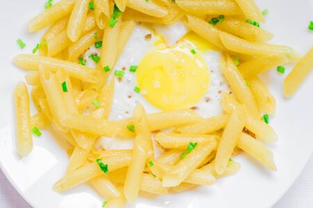 Fried eggs with pasta top viewの写真素材