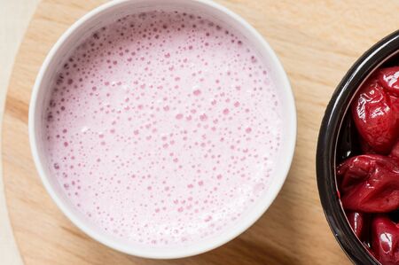 Smoothies with canned cherry cocktail with milk top viewの写真素材