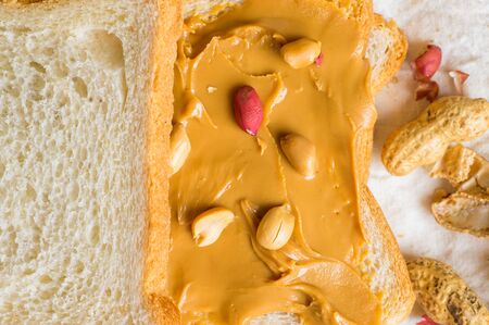 Sandwich with peanut butter toast for breakfast with nutsの写真素材