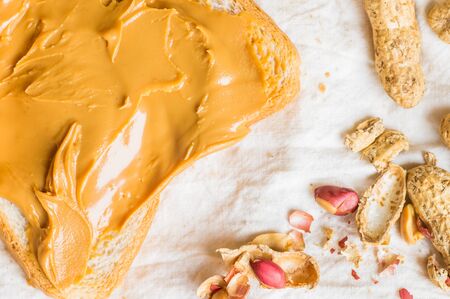 Sandwich with peanut butter toast for breakfast with nuts