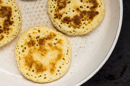 Pancakes four pieces in a pan view from aboveの写真素材