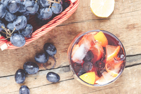 Sangria and grapes on the wooden table top viewの写真素材
