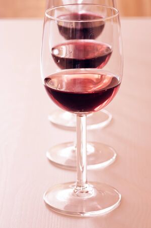 Three glasses with different red winesの写真素材