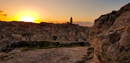 Beautiful sunset in the backgroud is old italian townの写真素材